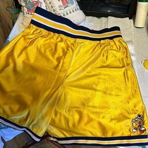 Threads-Gus Macker Basketball shorts. Size medium. Gold and blue